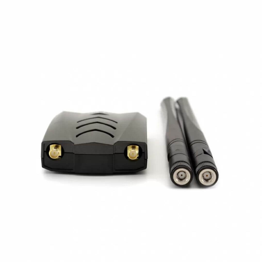 ALFA AWUS036ACH WiFi adapter shown with its RP-SMA connectors and dual 5dBi high-gain detachable antennas for enhanced wireless performance. Close-up of the ALFA AWUS036ACH adapter with dual RP-SMA antenna connectors and two detachable 5dBi antennas.